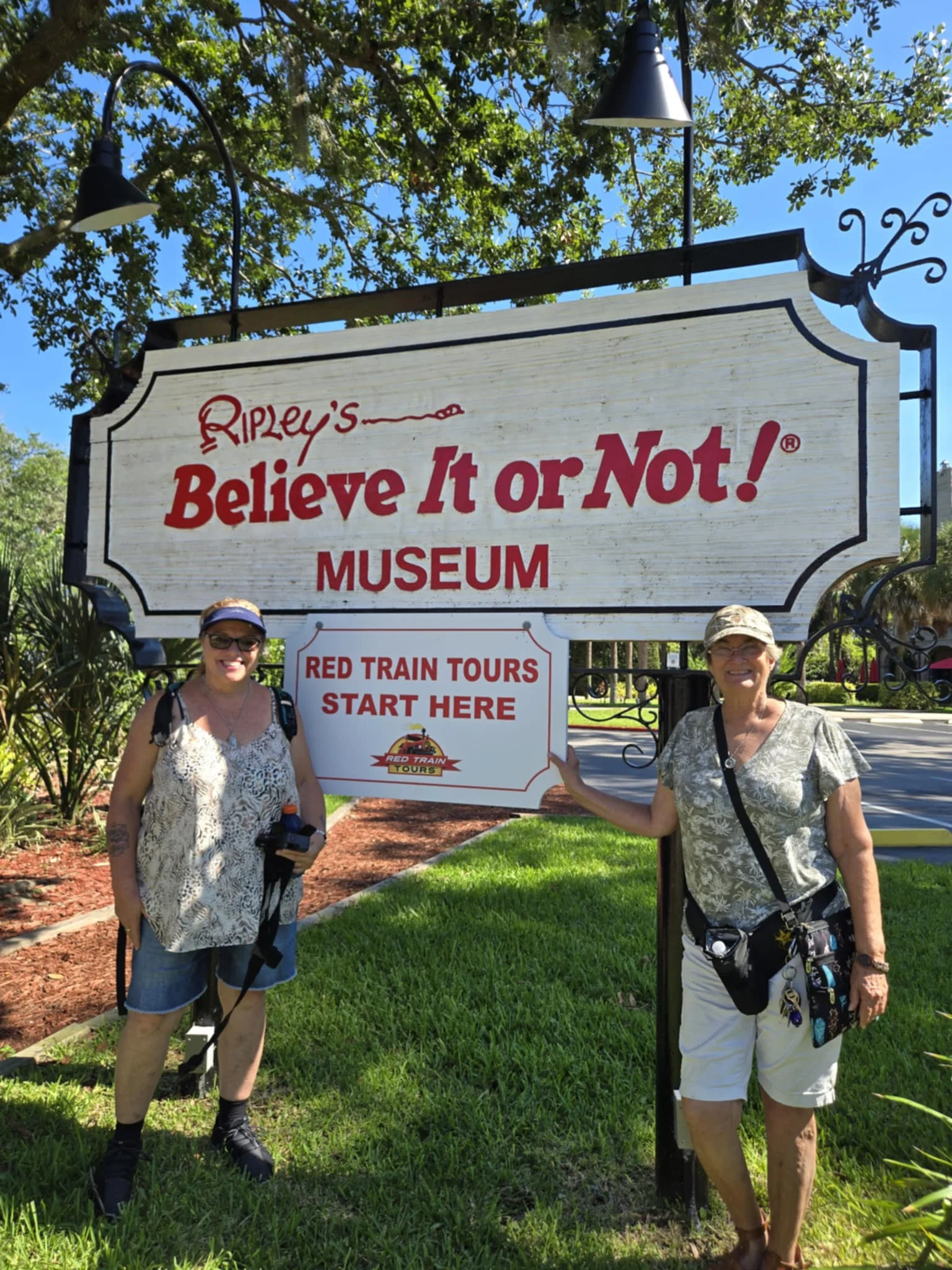 Two of our researchers at the Ripley's Believe It or Not! Museum sign in St. Augustine