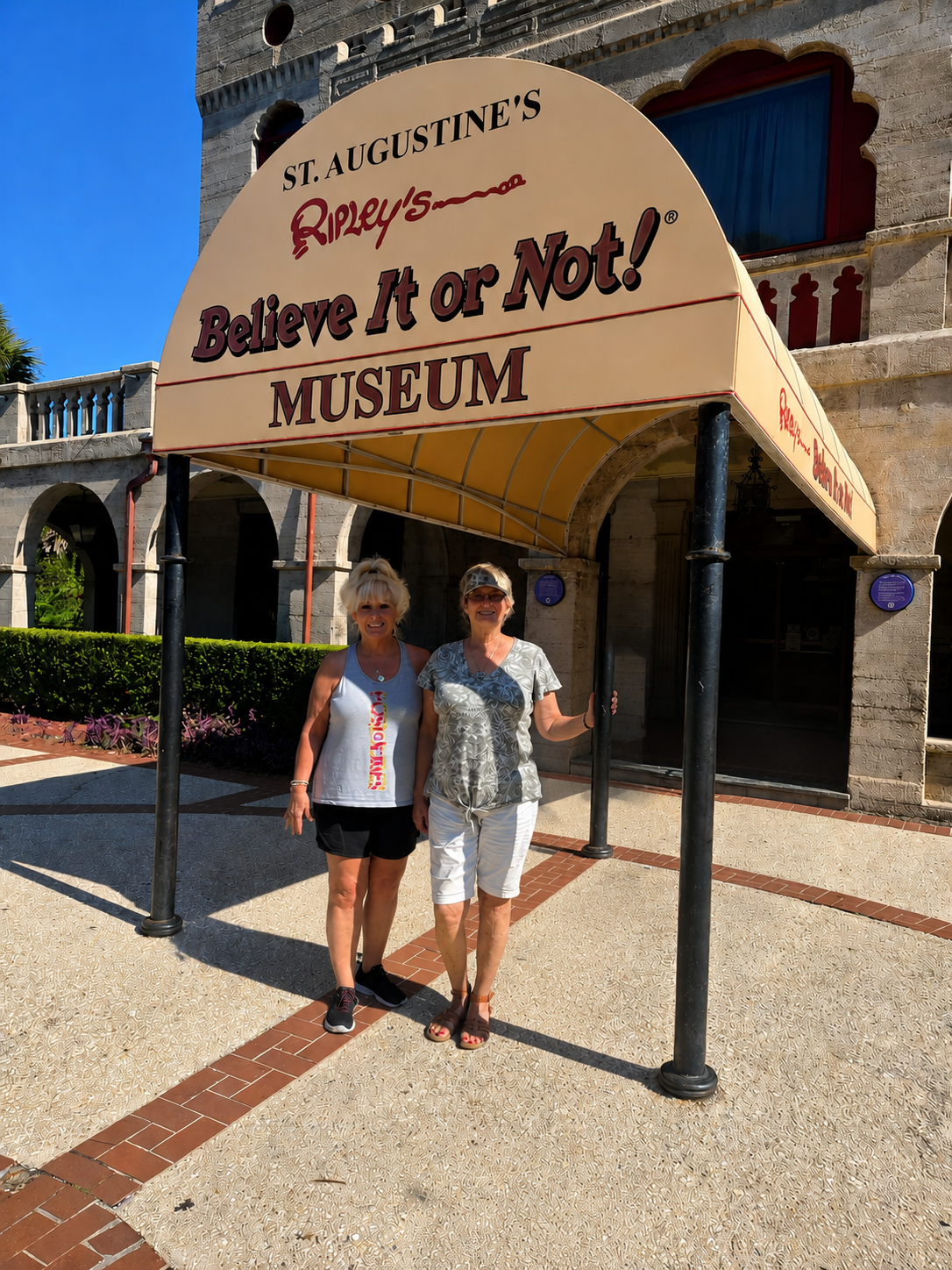Two of our researchers at the Ripley's Believe It or Not! Museum sign in St. Augustine